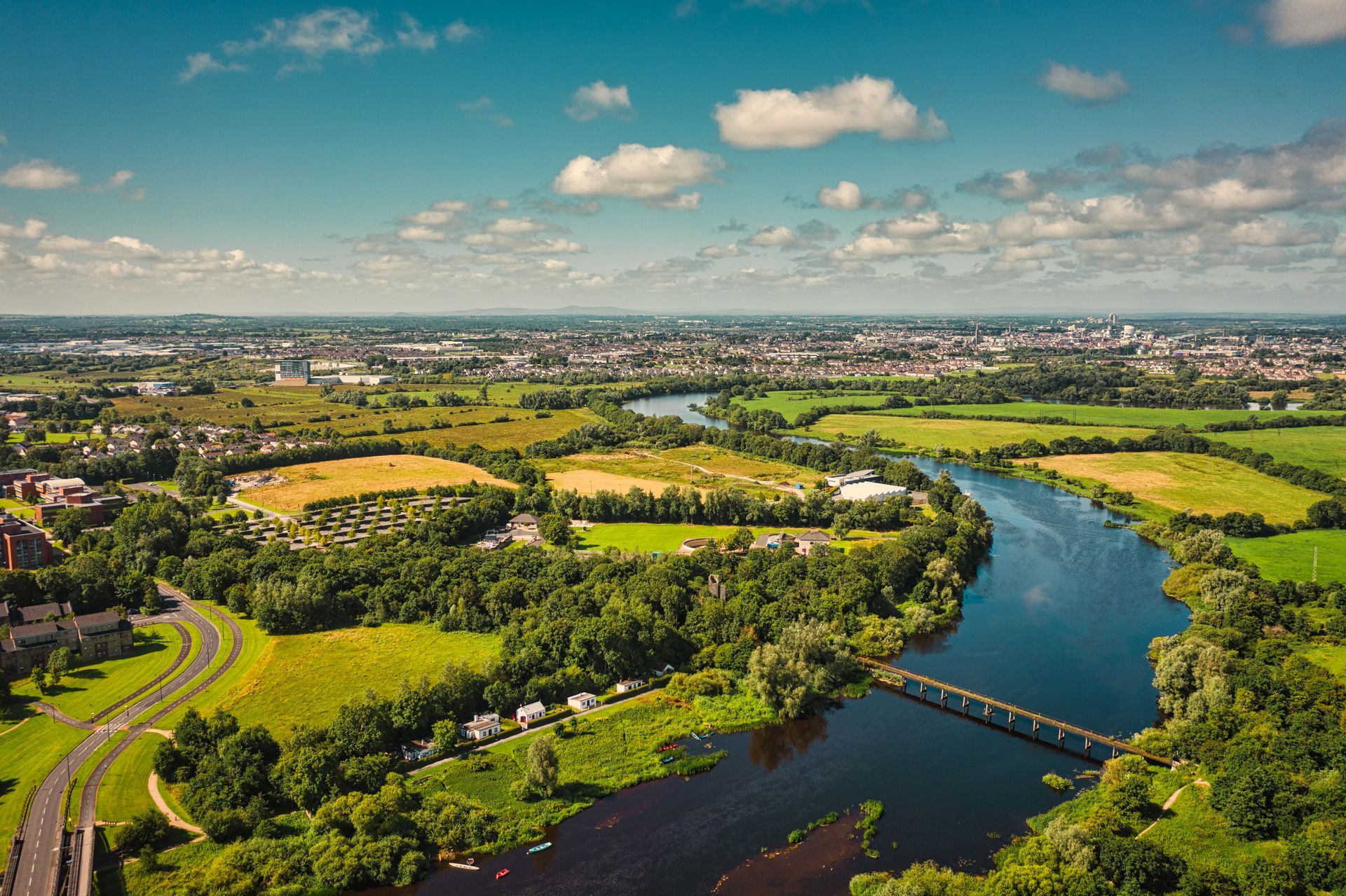 A river winding through green farmland